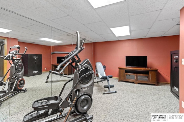 exercise area with a paneled ceiling