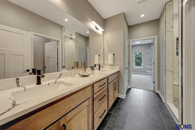 bathroom featuring walk in shower and vanity