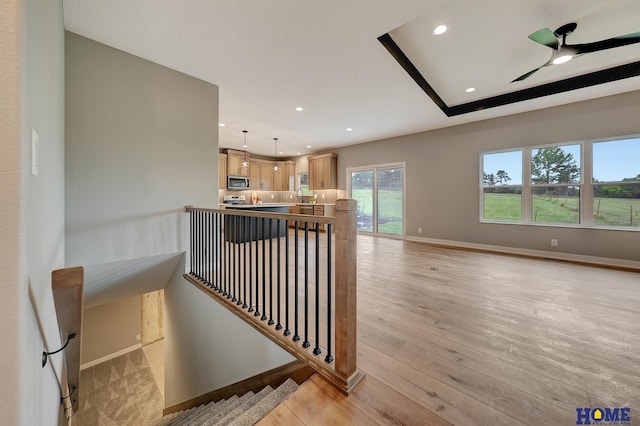 hall featuring sink and light hardwood / wood-style floors