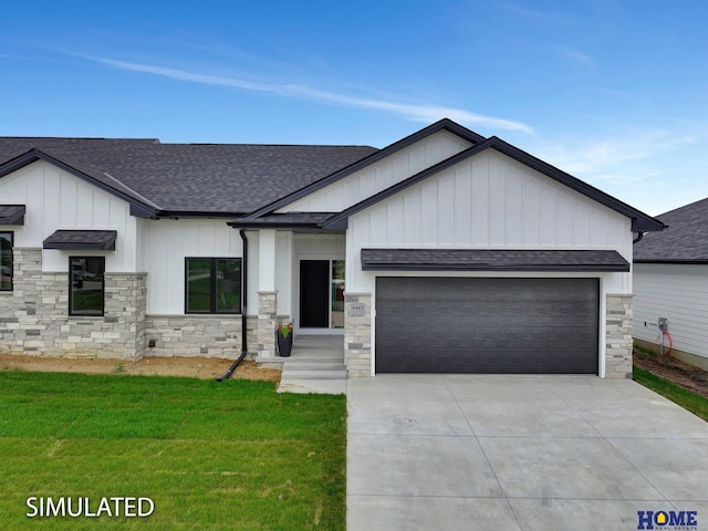 view of front of house with a garage and a front yard