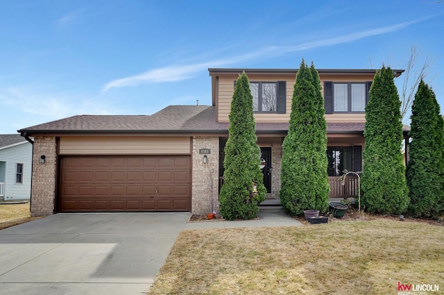 view of front facade featuring brick siding, a shingled roof, a front yard, a garage, and driveway