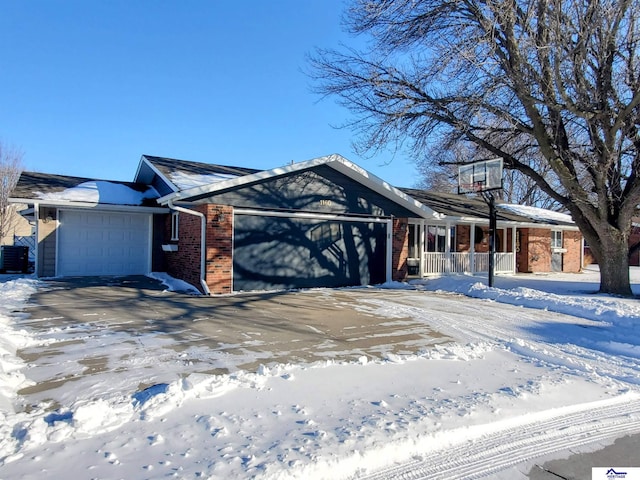 view of front of house featuring cooling unit and a garage