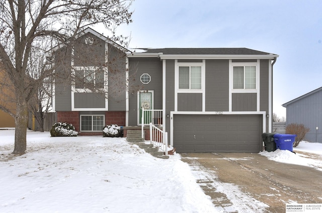 bi-level home featuring a garage