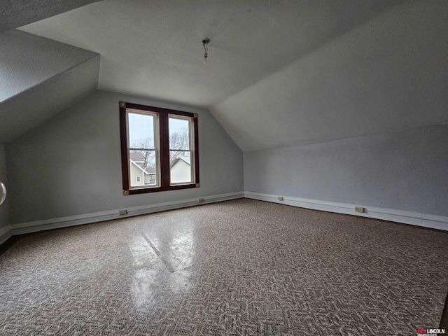 bonus room featuring lofted ceiling