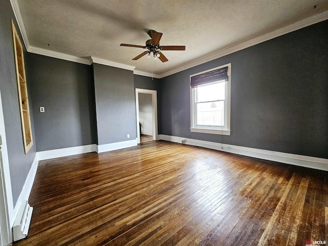 unfurnished room with ceiling fan, baseboard heating, wood-type flooring, ornamental molding, and a textured ceiling