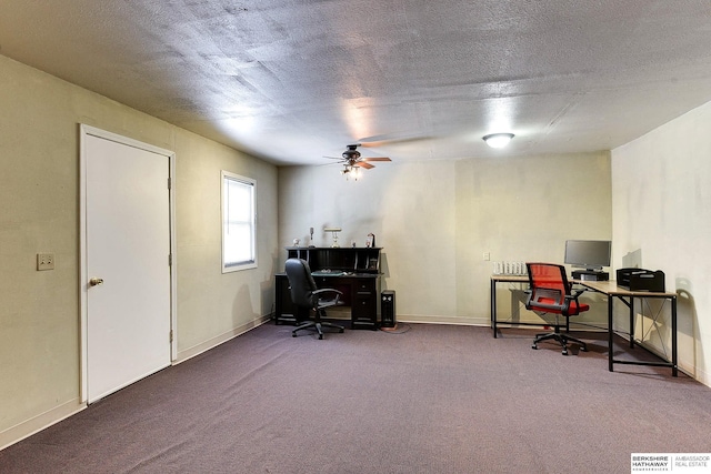 office area featuring ceiling fan, carpet floors, and a textured ceiling