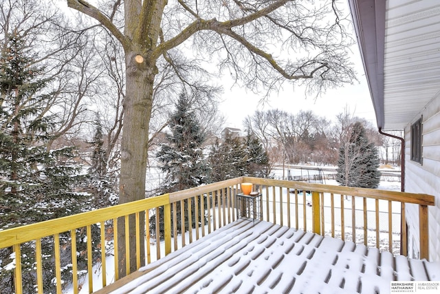 view of snow covered deck