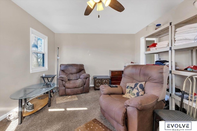 carpeted living room with ceiling fan