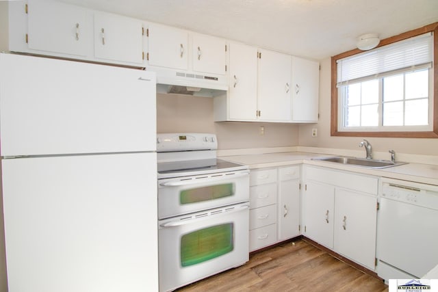 kitchen featuring sink, white appliances, white cabinetry, and light hardwood / wood-style floors