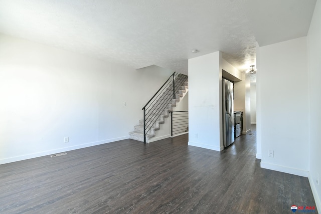 empty room featuring dark hardwood / wood-style floors