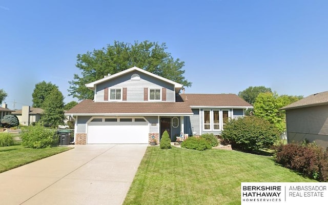 split level home featuring a front yard and a garage