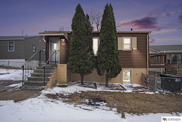 view of front of home featuring fence