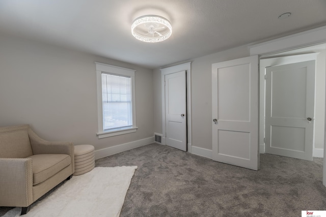 sitting room with carpet flooring