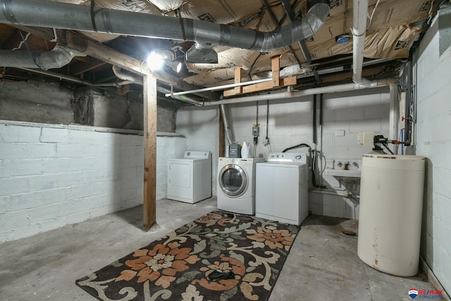 basement with gas water heater and washing machine and clothes dryer