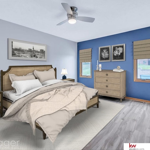 bedroom featuring ceiling fan, multiple windows, baseboards, and wood finished floors