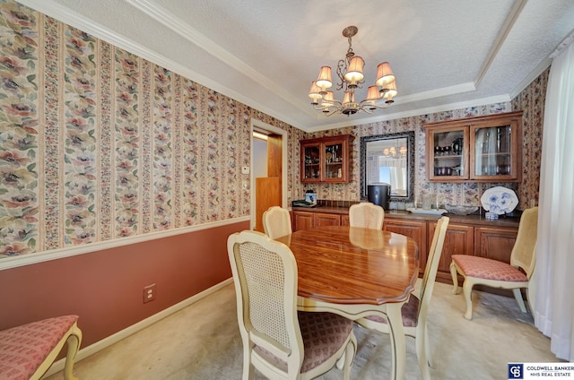 carpeted dining space featuring a notable chandelier, crown molding, and a textured ceiling