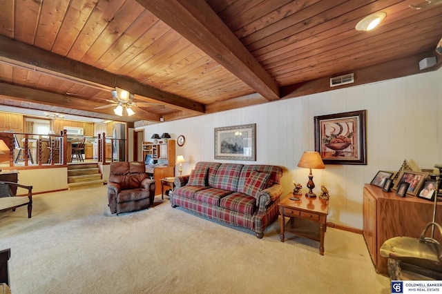 living room with beam ceiling, ceiling fan, light colored carpet, and wooden ceiling