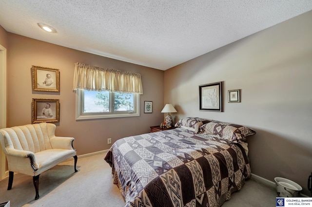 carpeted bedroom with a textured ceiling