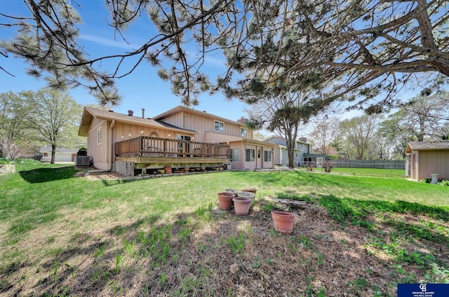 view of yard featuring a wooden deck, fence, and cooling unit