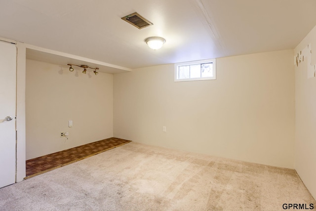 basement featuring carpet flooring