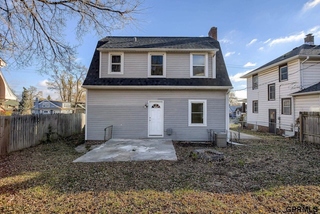 back of house featuring central air condition unit and a patio area