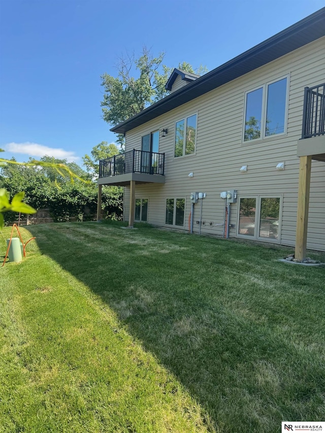 307 S 55th St, Lincoln, NE 68510 - rear view of property featuring a yard and a deck