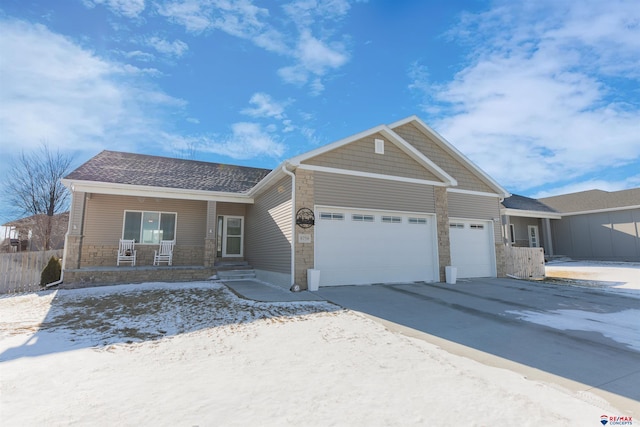 view of front of home with a garage and covered porch