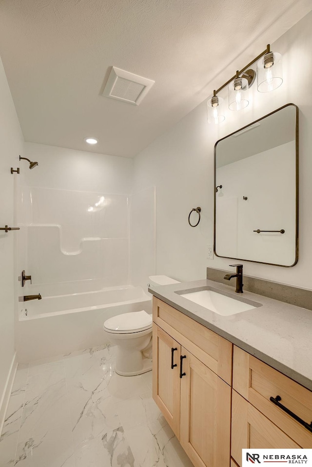 full bathroom with toilet, marble finish floor, vanity, and bathing tub / shower combination