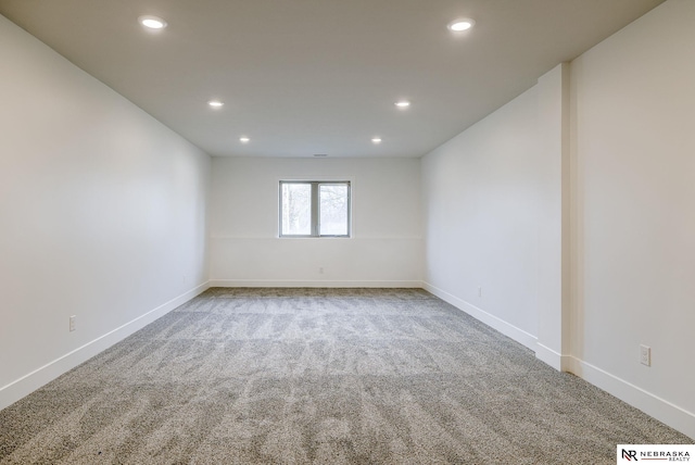 carpeted spare room with baseboards and recessed lighting