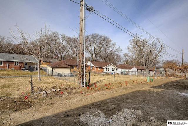 view of yard with a residential view and fence