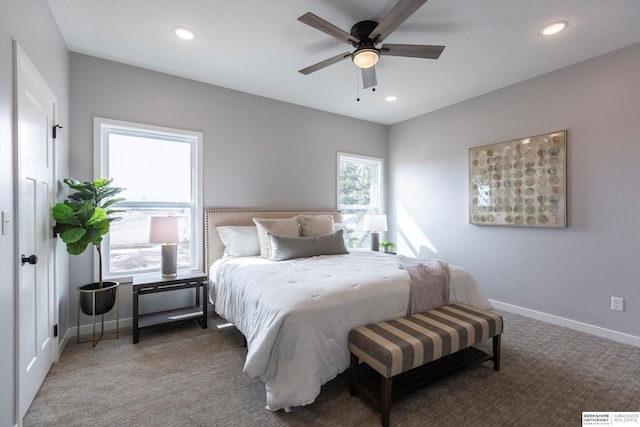 carpeted bedroom featuring ceiling fan, baseboards, and recessed lighting