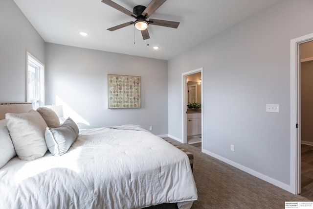 bedroom featuring recessed lighting, dark carpet, baseboards, and ensuite bathroom