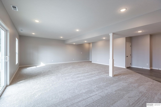 basement with carpet, baseboards, visible vents, and recessed lighting