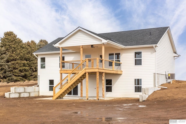 back of property featuring roof with shingles, central AC unit, ceiling fan, a deck, and stairs