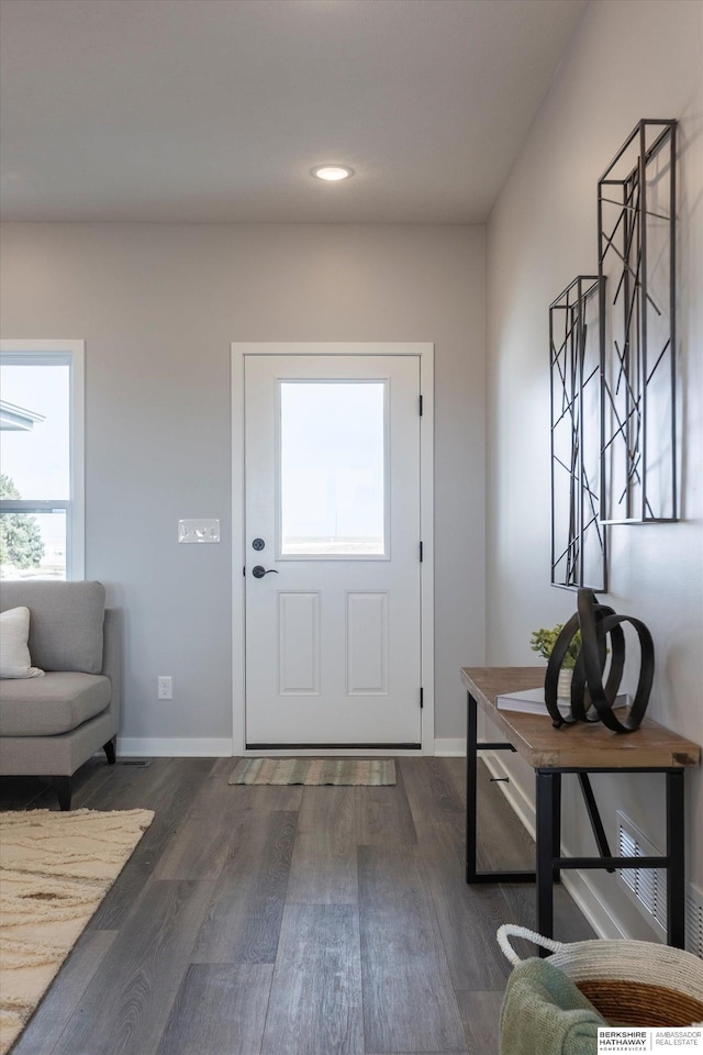 entryway featuring dark wood-type flooring, recessed lighting, and baseboards