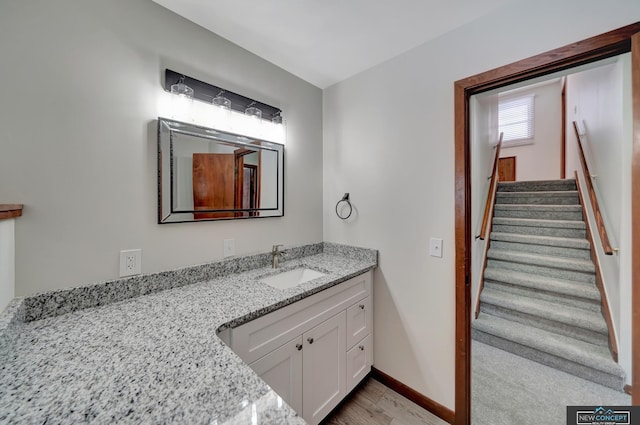 bathroom featuring vanity and hardwood / wood-style floors