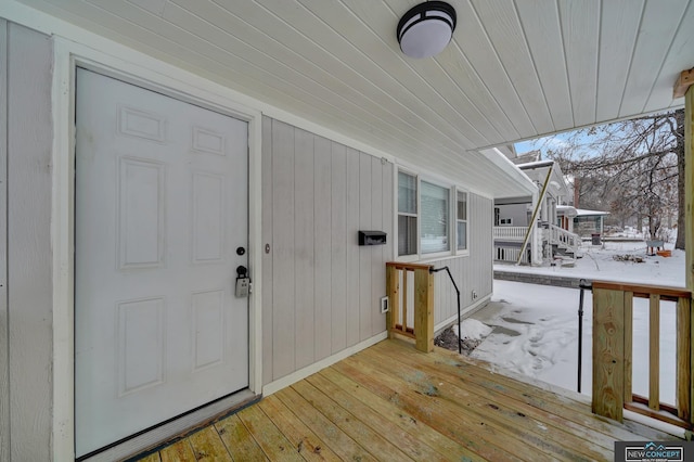 view of snow covered property entrance