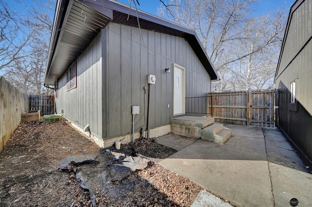 view of side of home featuring a fenced backyard