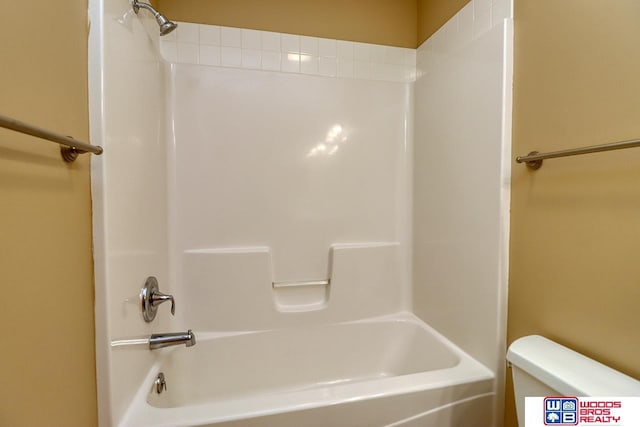 bathroom with toilet and shower / bathing tub combination