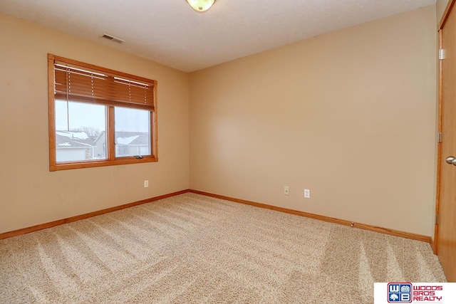 view of carpeted spare room