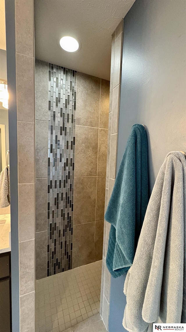 bathroom with a tile shower