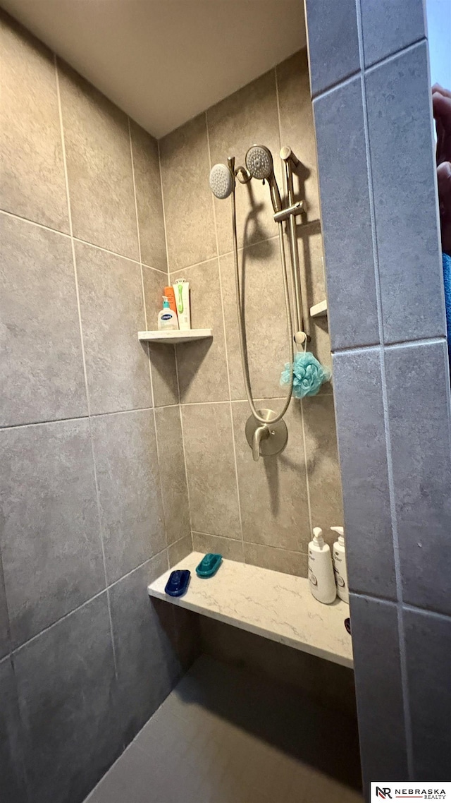 bathroom with tiled shower