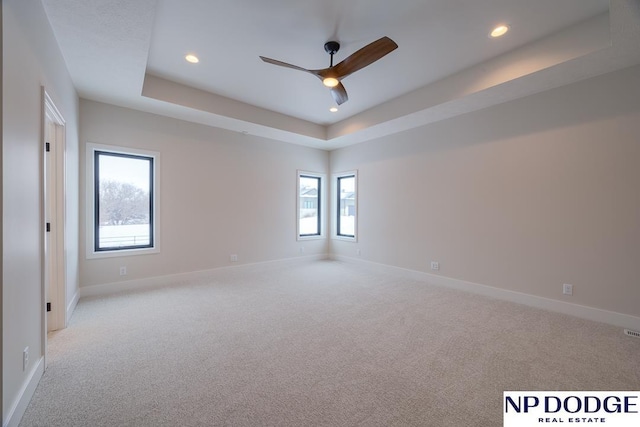 8909 Appaloosa Ln, Lincoln, NE 68520 - empty room featuring recessed lighting, a ceiling fan, carpet floors, and a raised ceiling