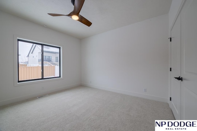8909 Appaloosa Ln, Lincoln, NE 68520 - carpeted empty room with visible vents, baseboards, and ceiling fan