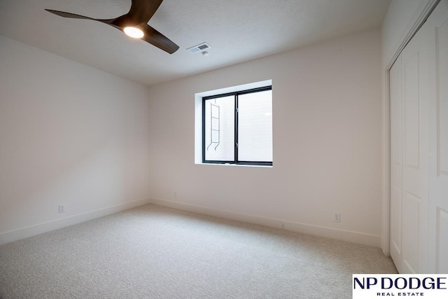 8909 Appaloosa Ln, Lincoln, NE 68520 - unfurnished room featuring baseboards, a ceiling fan, visible vents, and carpet