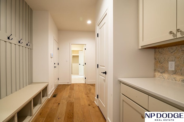 8909 Appaloosa Ln, Lincoln, NE 68520 - mudroom featuring recessed lighting, light wood-type flooring, visible vents, and baseboards