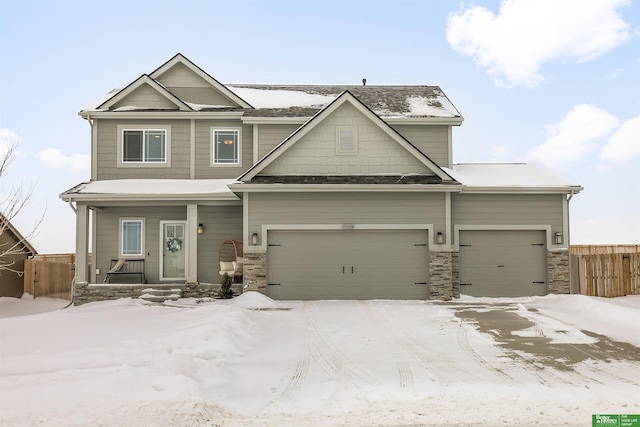 craftsman inspired home with a garage and a porch