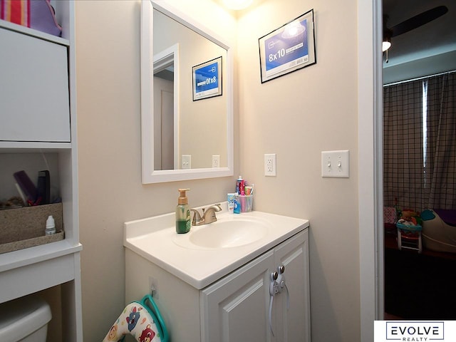 bathroom with toilet and vanity