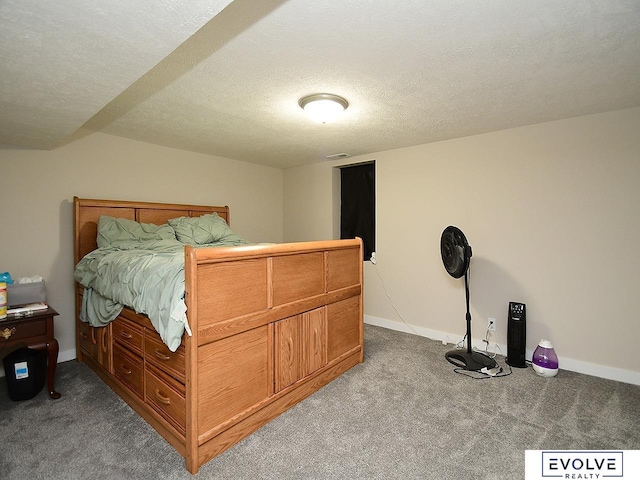 carpeted bedroom featuring a textured ceiling