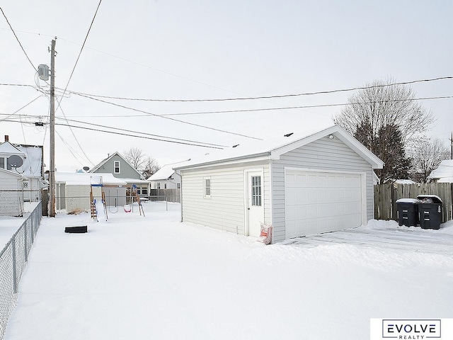 view of snow covered garage